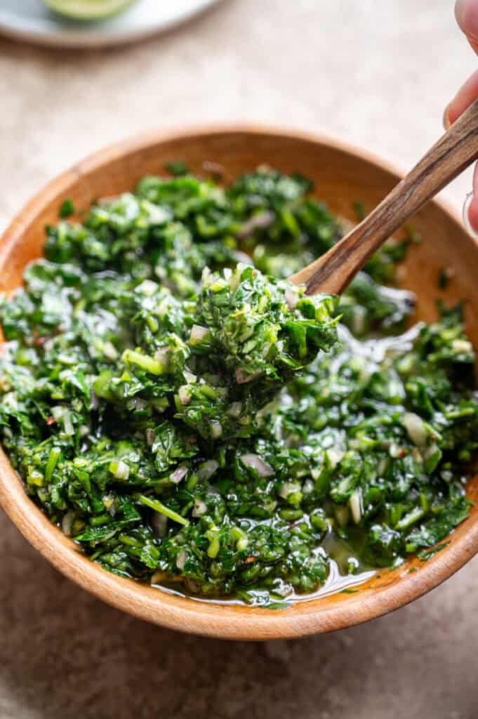 close up shot of cilantro and parsley chimichurri. 