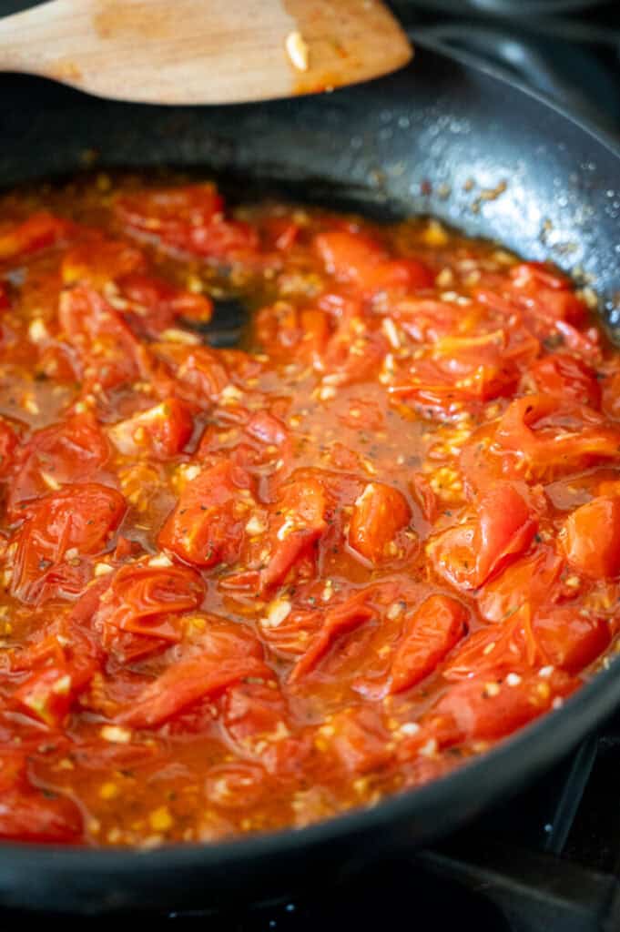 tomato sauce cooking in a pan.