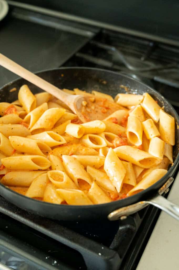 tomato penne pasta in a skillet.