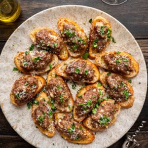 sausage bruschetta on a plate.