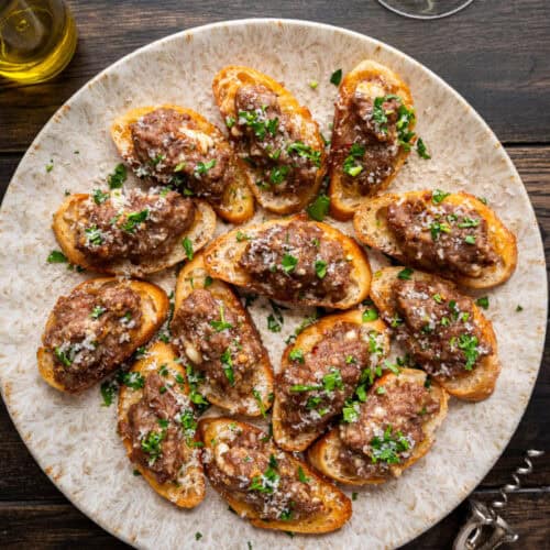 sausage bruschetta on a plate.