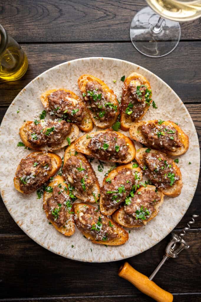 sausage bruschetta on a plate.
