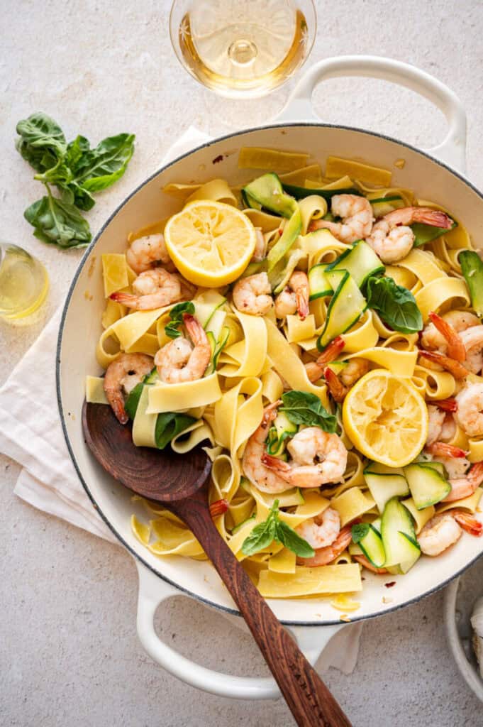 pappardelle with zucchini and shrimp in a skillet.