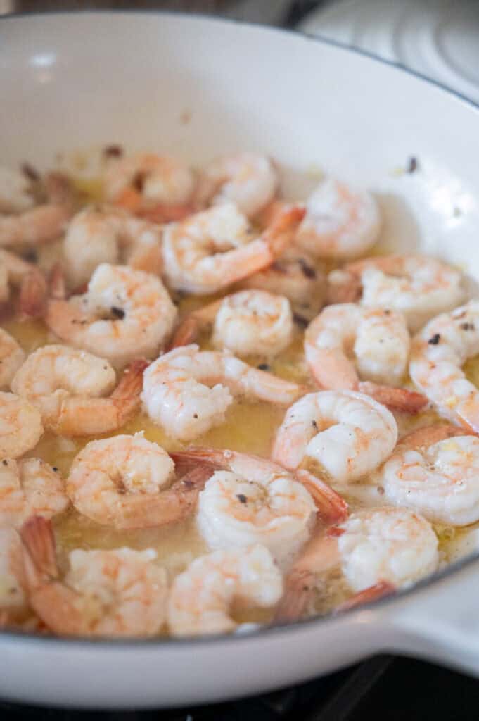 shrimp cooking in a skillet.