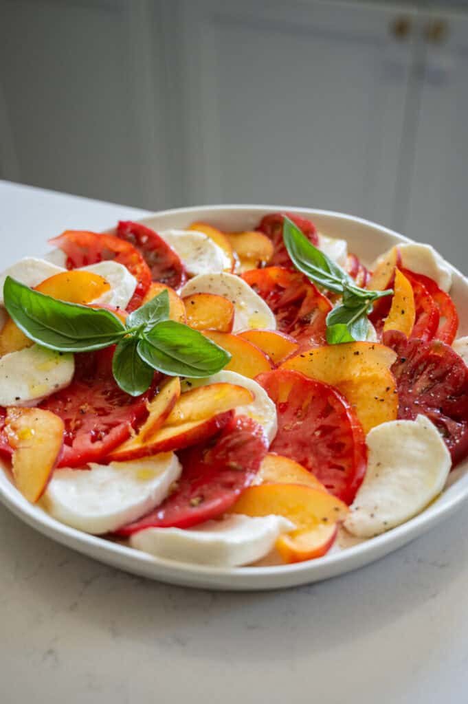 peach caprese salad with basil.