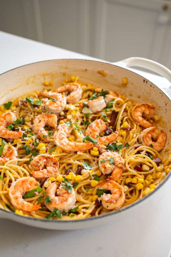 corn and shrimp carbonara in a large pan.