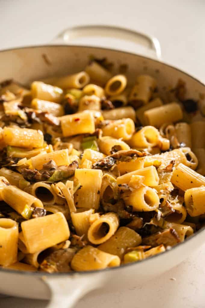 mushroom and leek pasta in a skillet.