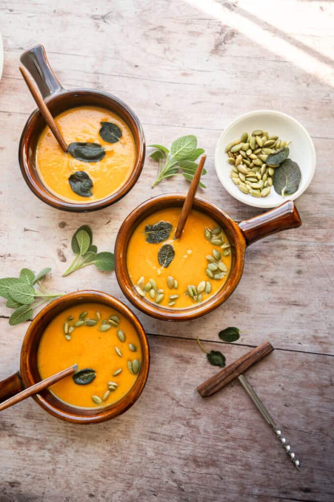 carrot and butternut squash soup in bowls.