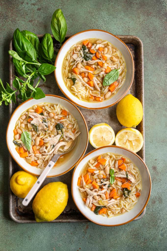 lemon chicken orzo soup in bowls.