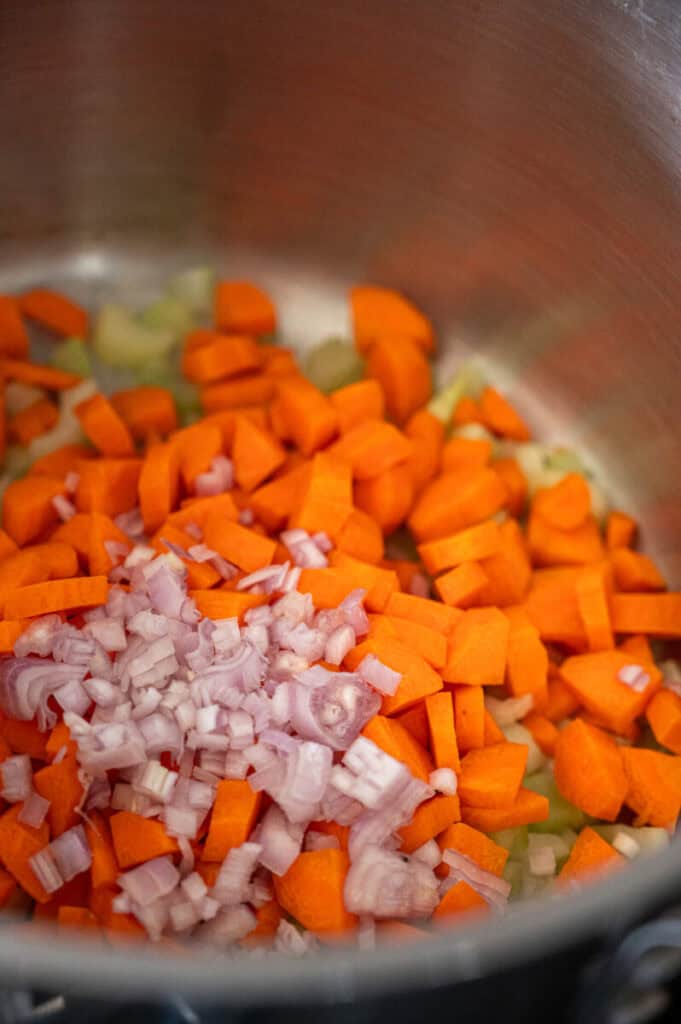 veggies cooking in a pot.