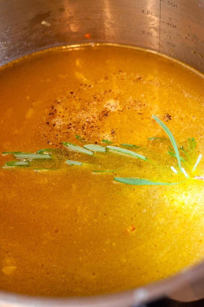 chicken stock in a pot.