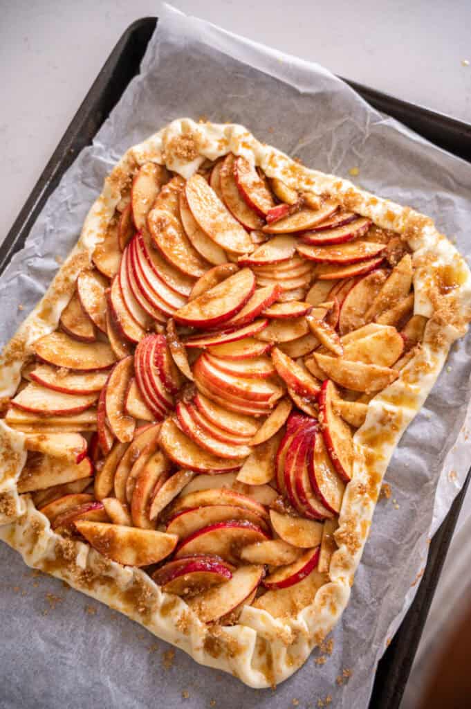 assembled apple galette on a baking sheet.