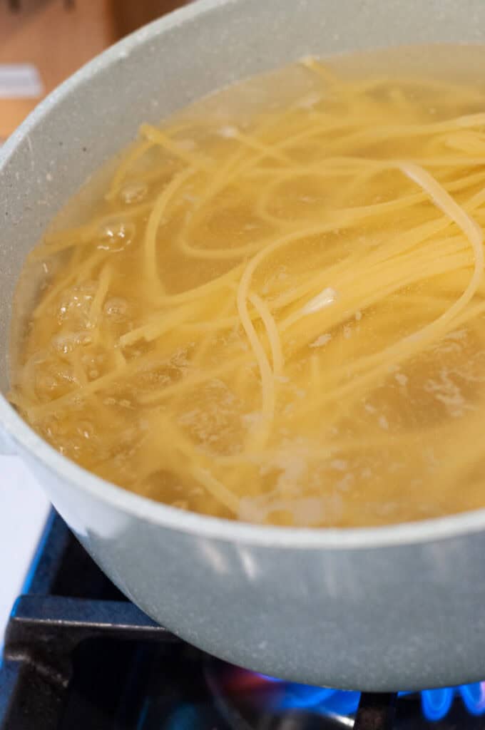 linguine cooking in a pot.