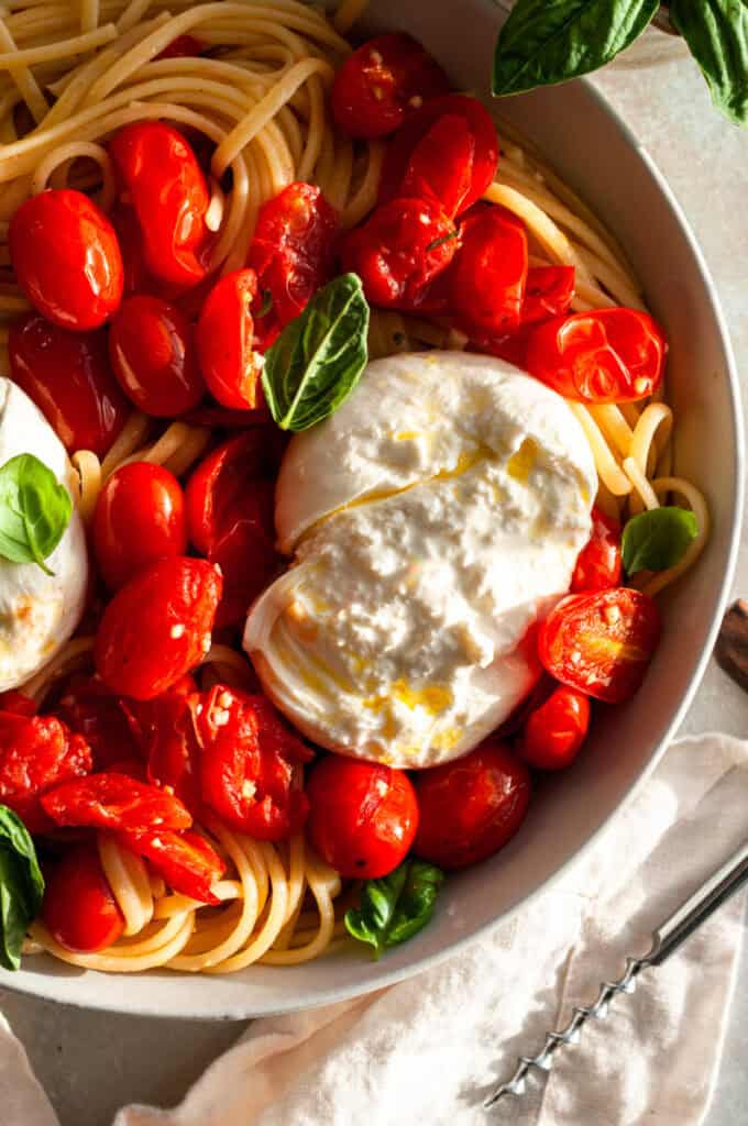 burrata with tomatoes and pasta.