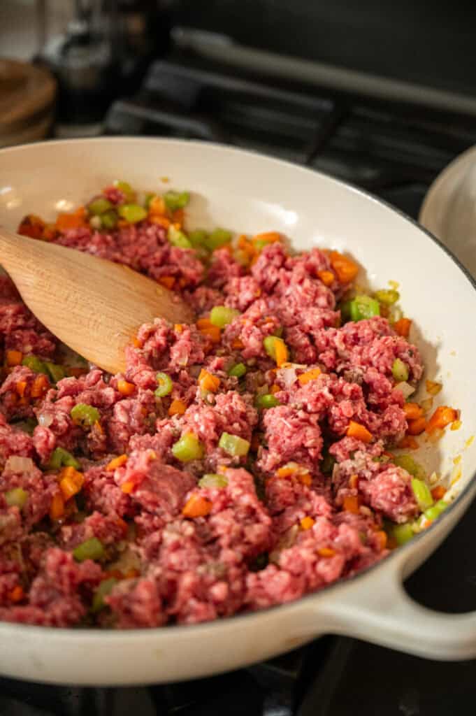 ground beef and vegetables in a skillet.