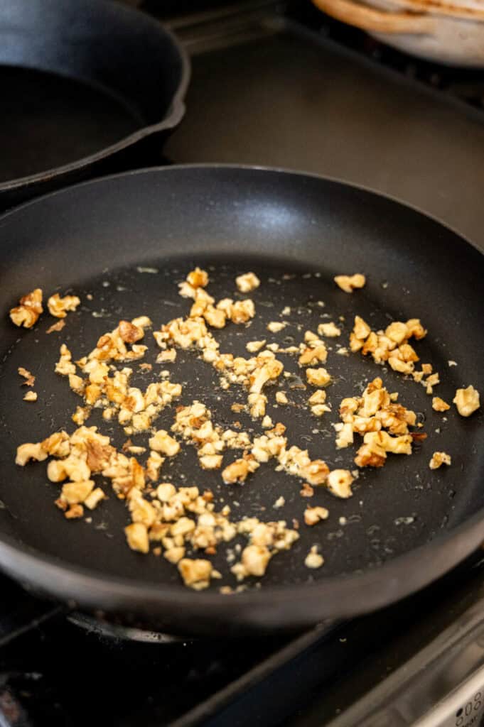 toasted walnuts in a pan.