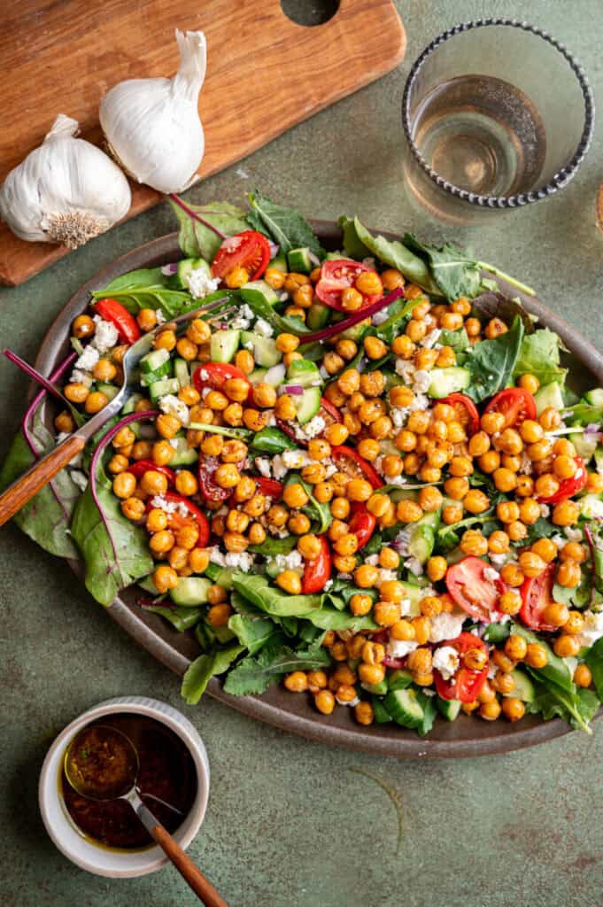 crispy chickpea salad on a platter with a fork.
