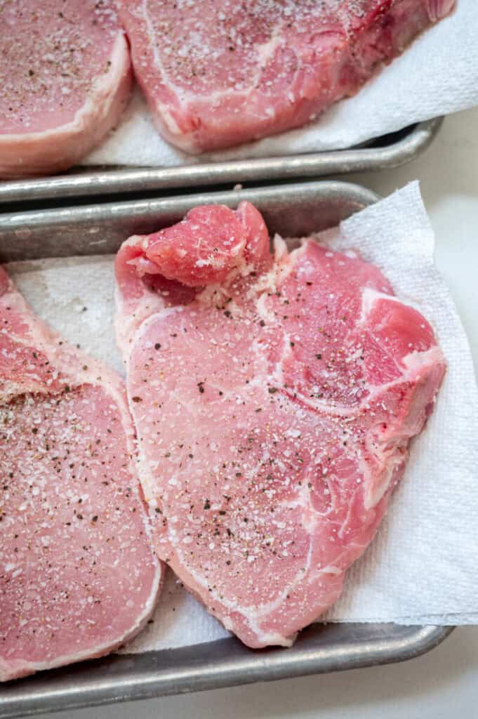 pork chops seasoned with salt and pepper.