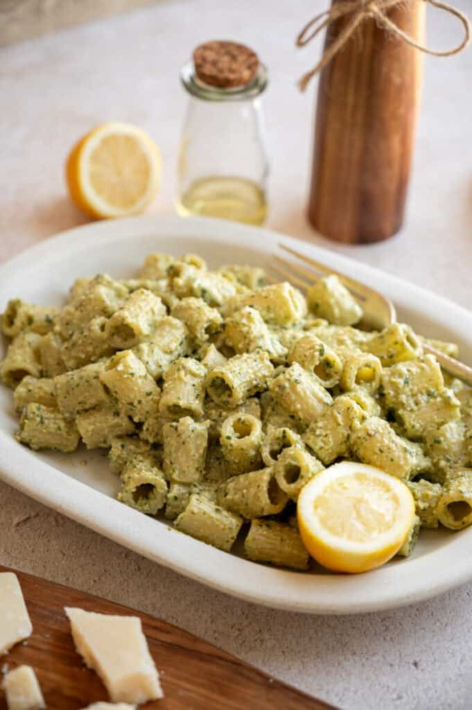 pesto pasta on a plate with a fork.