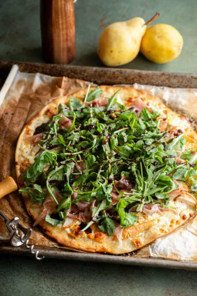 pear, proscuitto, and arugula pizza.