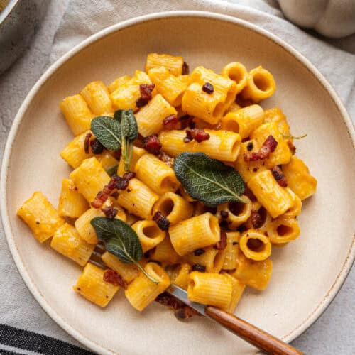 pumpkin pasta carbonara in a bowl.