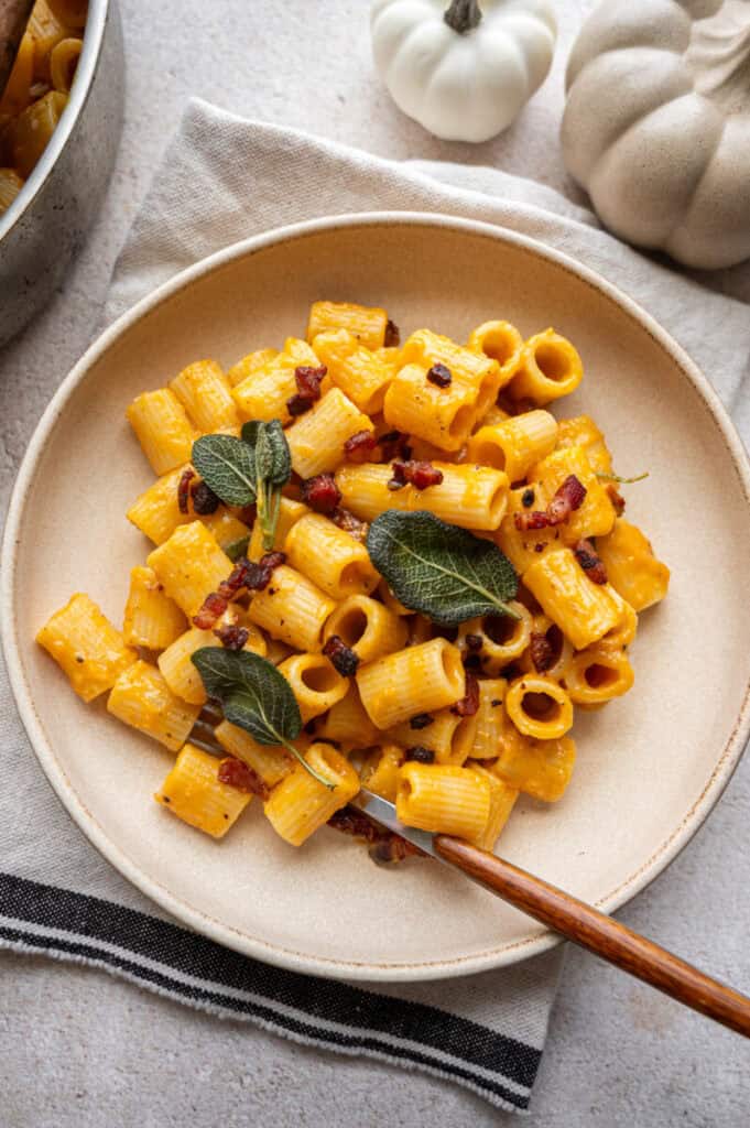 pumpkin pasta carbonara in a bowl.