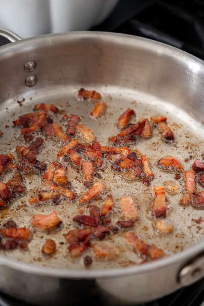 pancetta cooking in a pan.