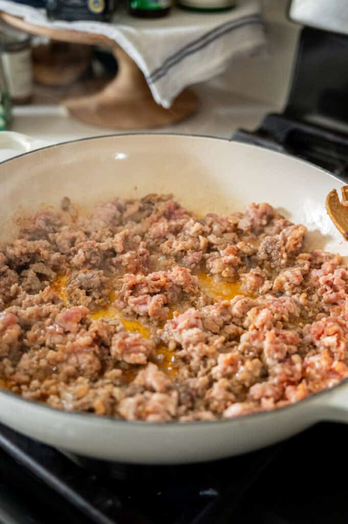 browned sausage in a skillet.
