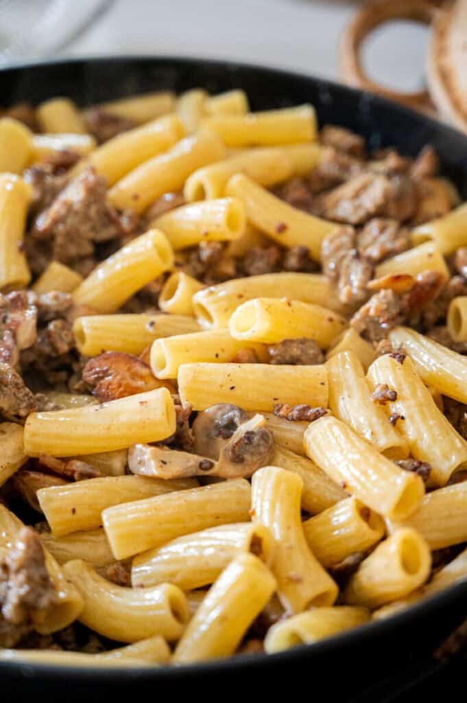 rigatoni with sausage in a skillet.