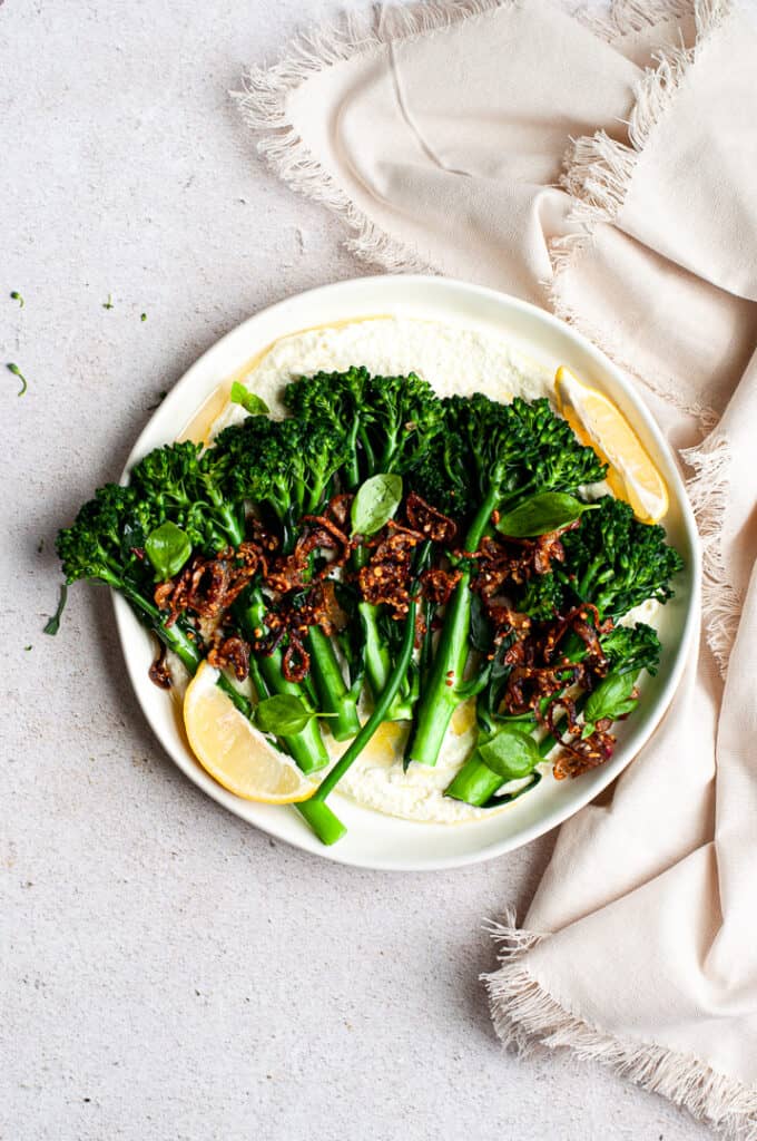 Broccolini on a plate with a napkin