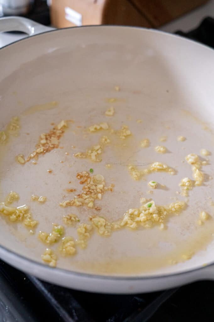 garlic sautéing in a pan.