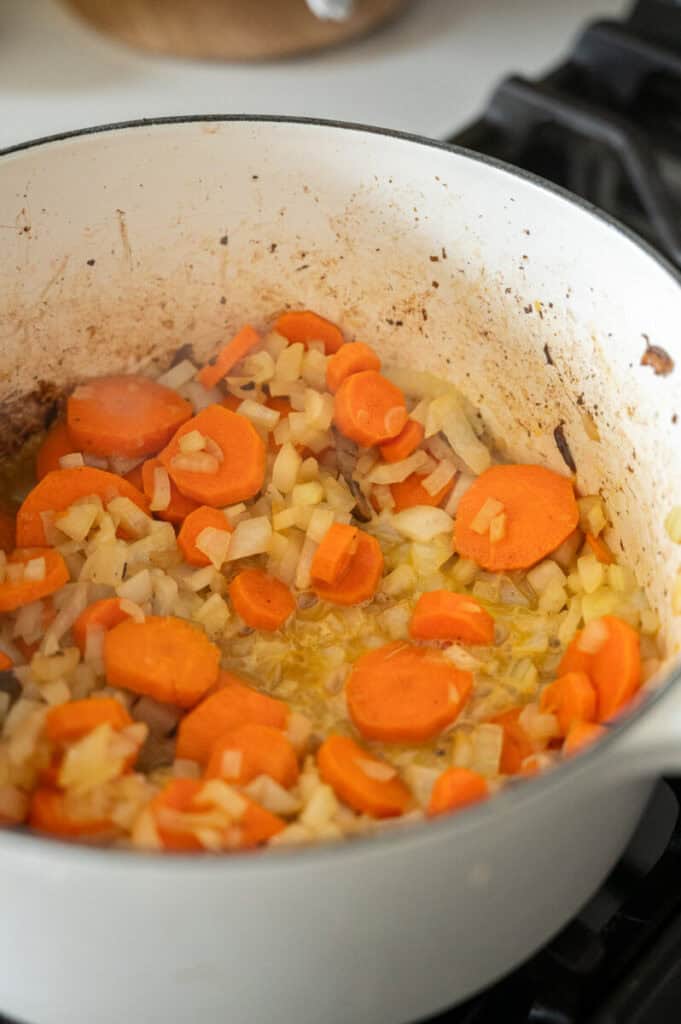 carrots and onions cooking in olive oil.