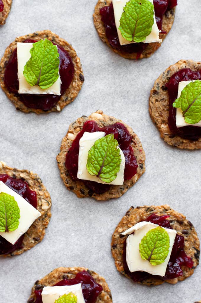 Crackers, Brie, and Cranberry Sauce with mint