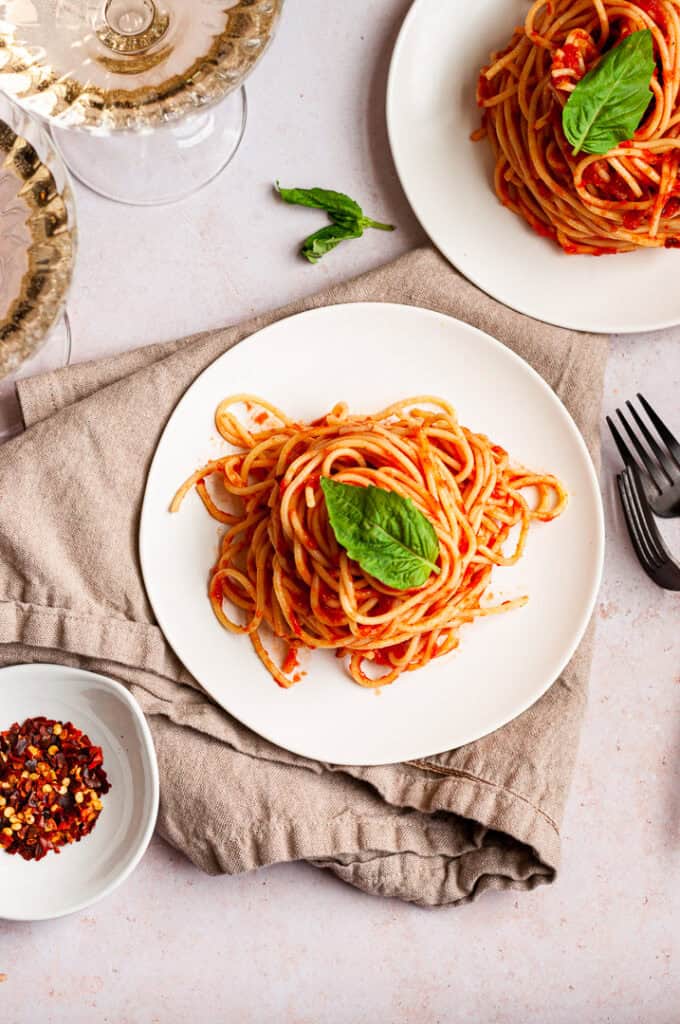 spaghetti arrabbiata with fresh basil.