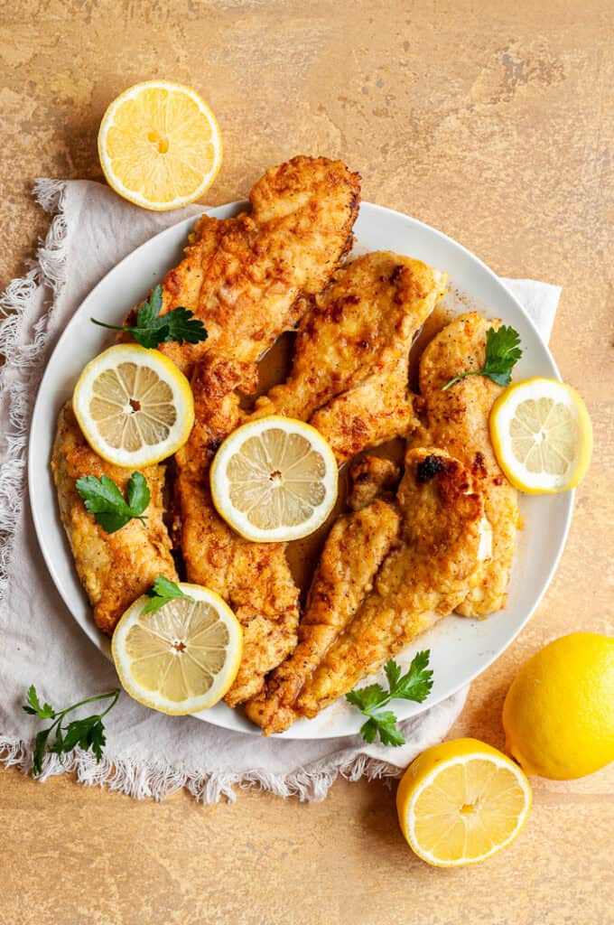 chicken limone on a plate.
