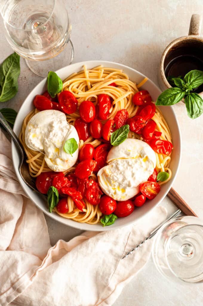 pasta, tomatoes, and burrata in a bowl