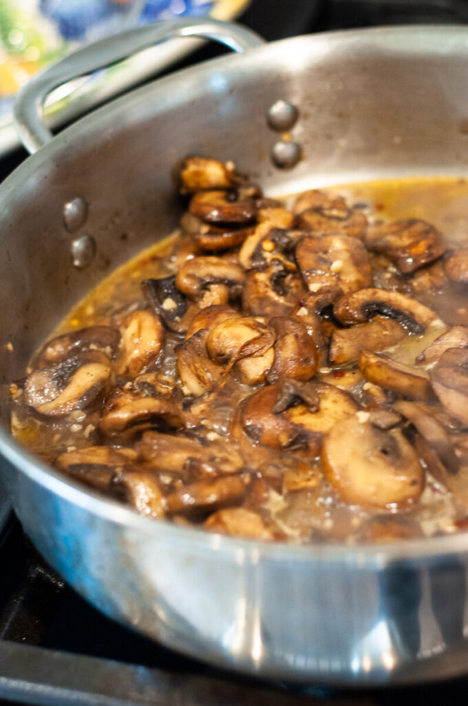 mushrooms and wine in a skillet