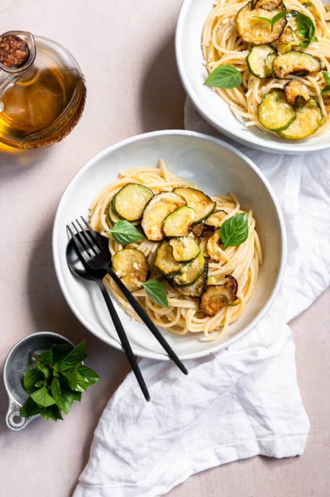 pasta in bowl with zucchini and basil