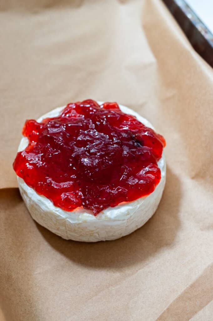 brie topped with strawberry jam
