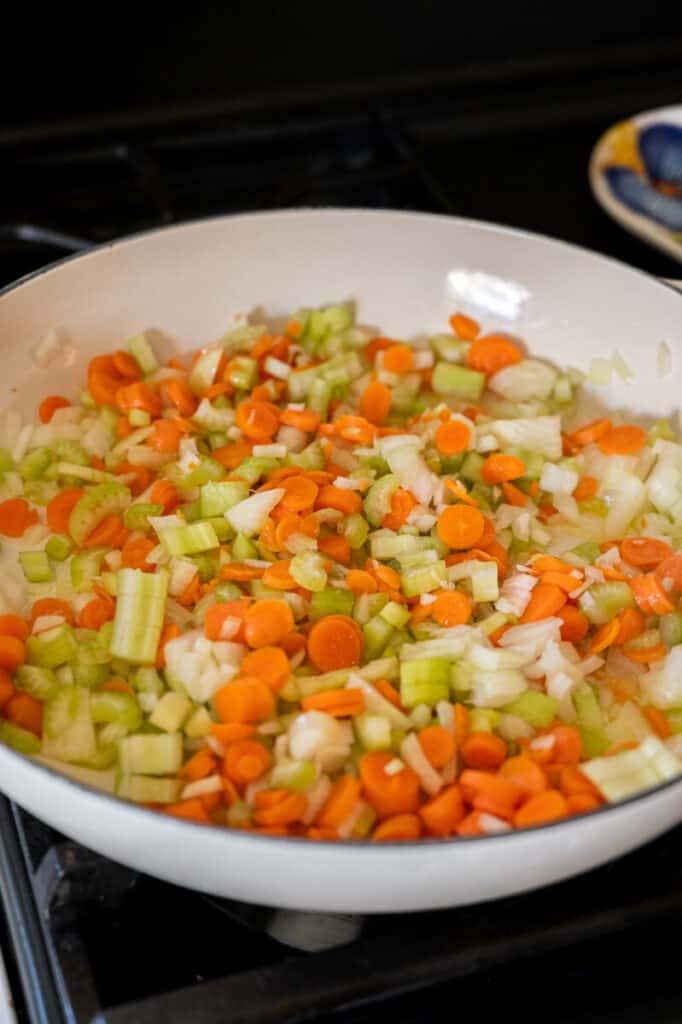 carrots, onion, celery in a pan