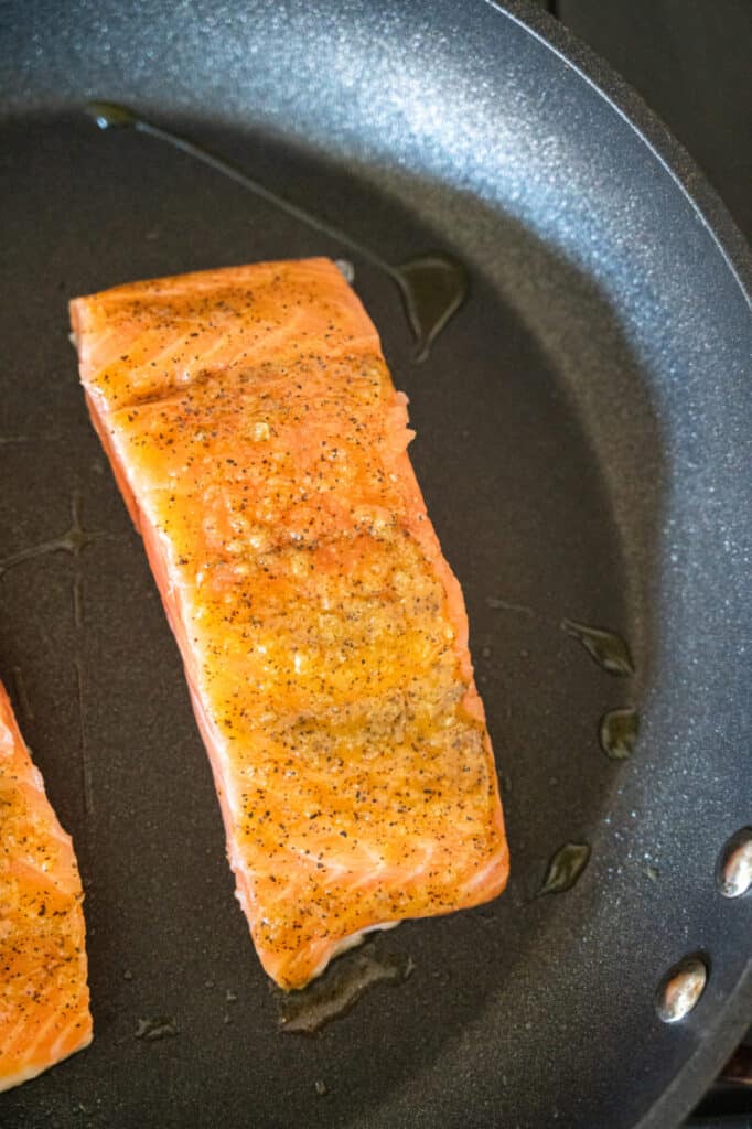 salmon searing in a skillet