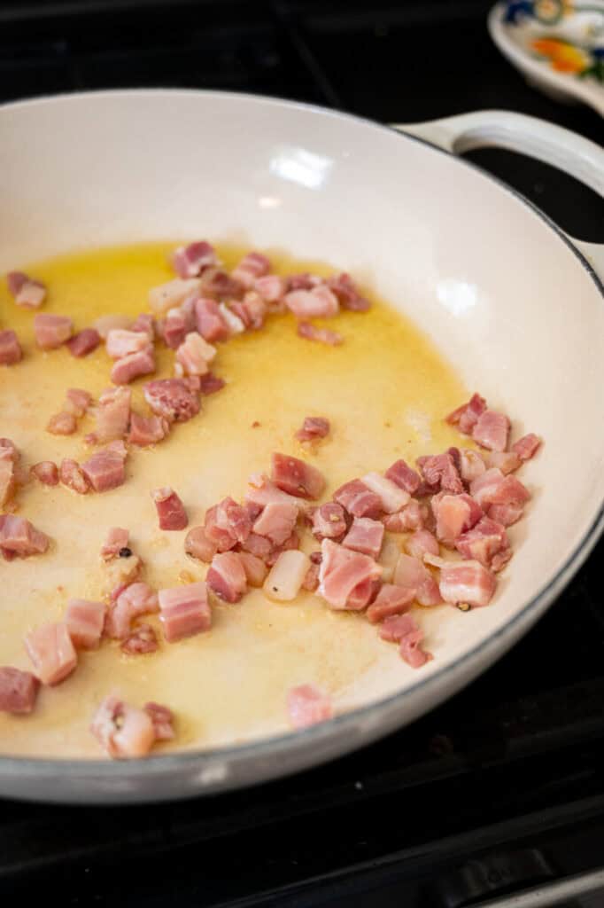 pancetta cooking in a pan.