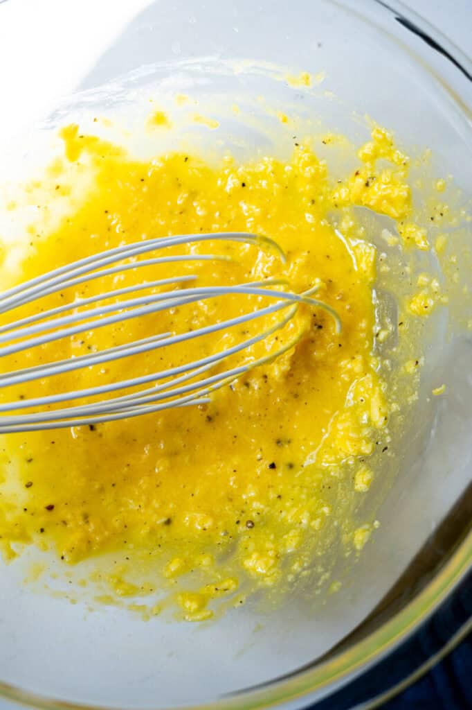 egg yolks and pecorino in a bowl.