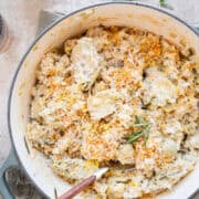 artichoke risotto in a large pot with a spoon