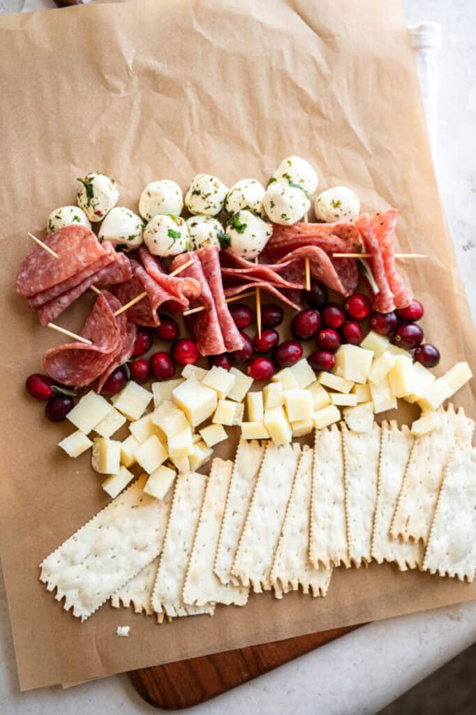 salami, meats, and cheeses on a board.
