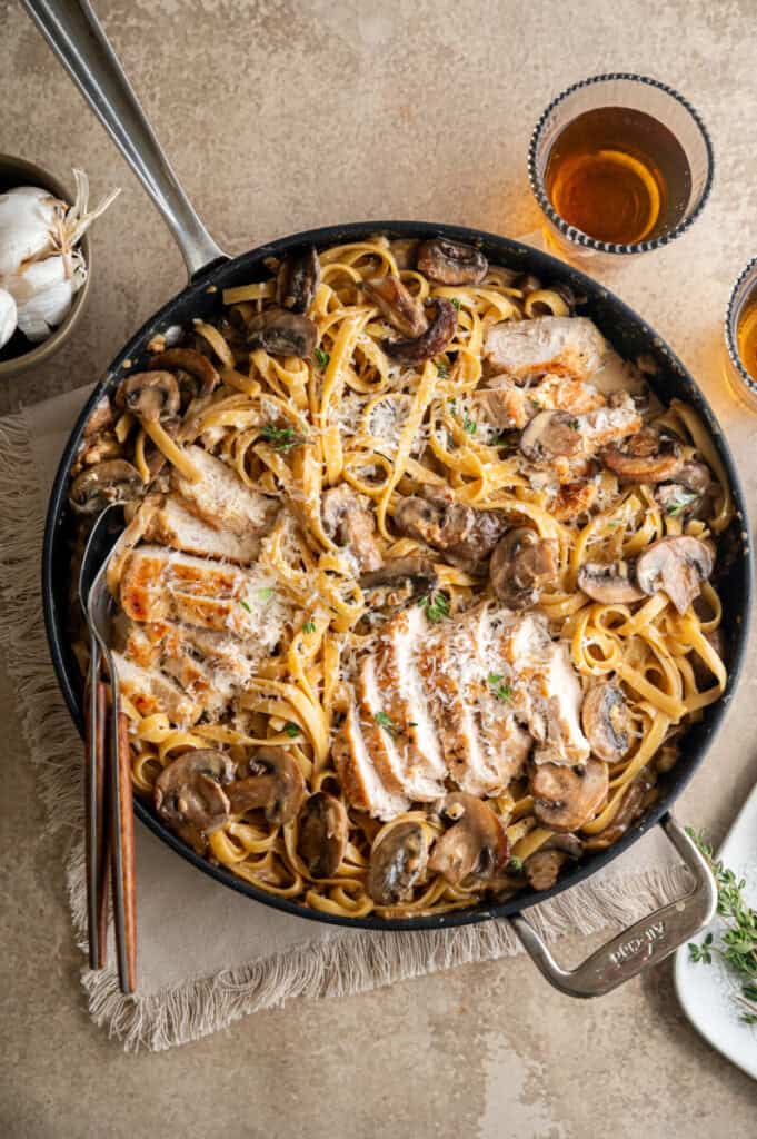 chicken Marsala Fettuccine alfredo in a pan.