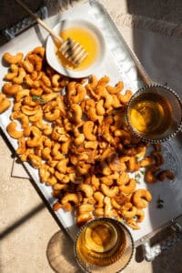 honey roasted cashew nuts on a platter.