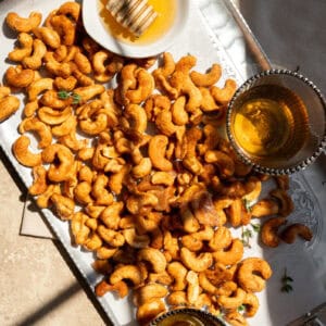 honey roasted cashew nuts on a platter.