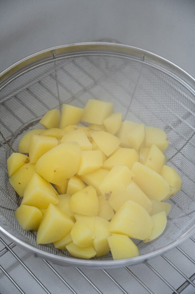 cooked potatoes in a colander.