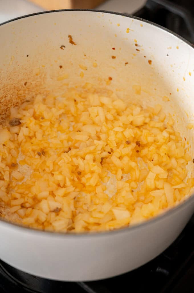onions cooking in a pot.